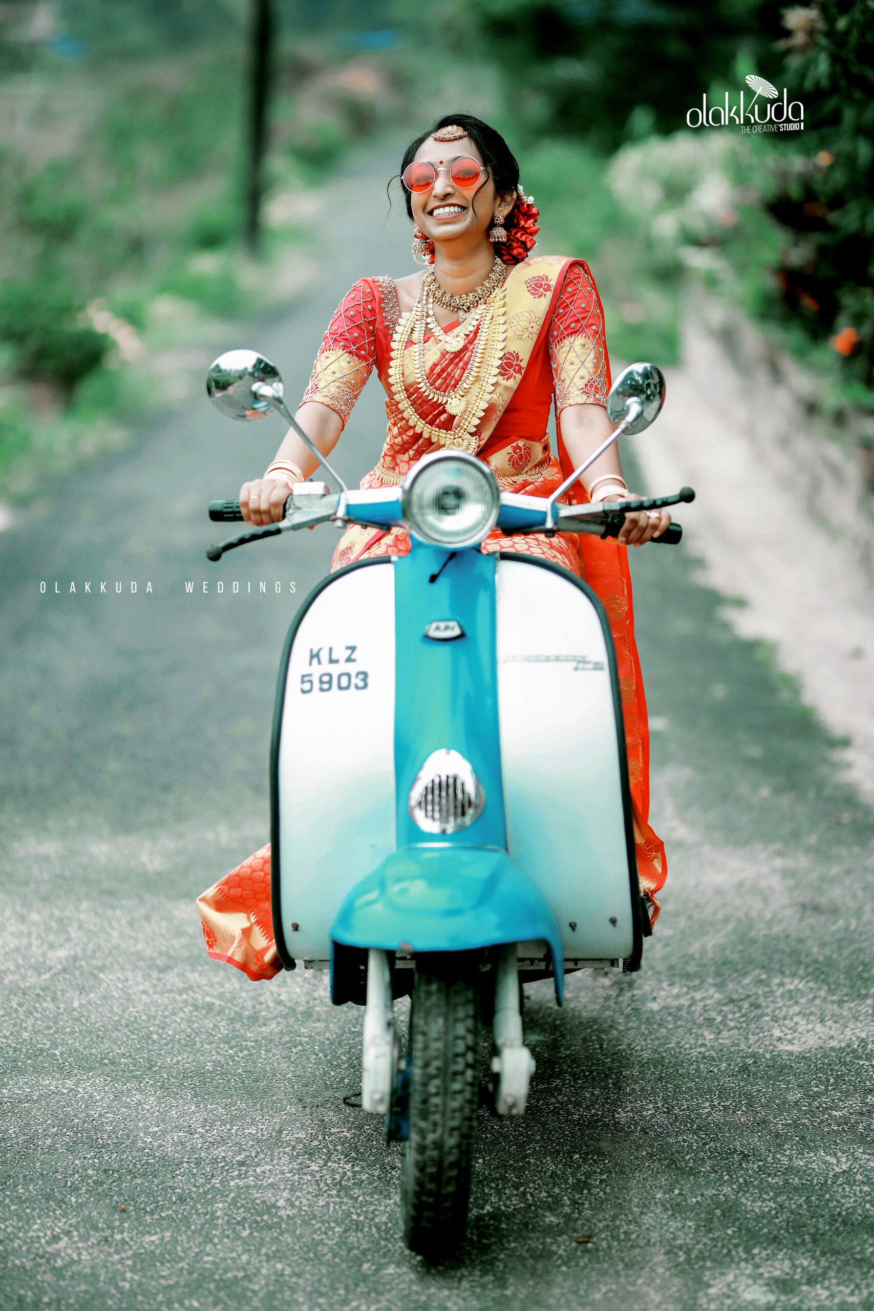 bride riding on scooty